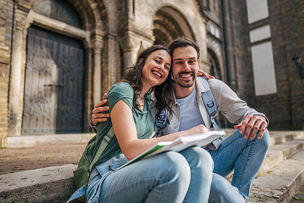 istock Cheerful students studying together outside university building 2213464534