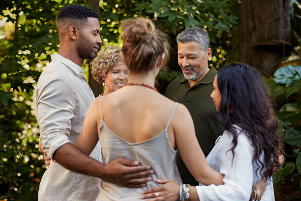 istock People hugs in circle with solidarity and gratitude 2213466436