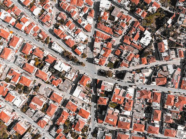 Aerial view of Kalloni, Lesvos, Greece, showcasing red-roofed buildings and intersecting streets.
