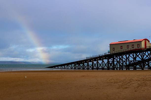 istock Lifeboat station and rainbow on Tenby beach 2213466894