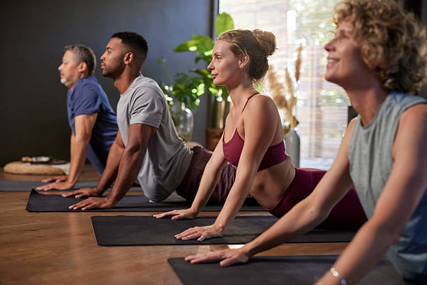 Yoga class group during lesson at gym