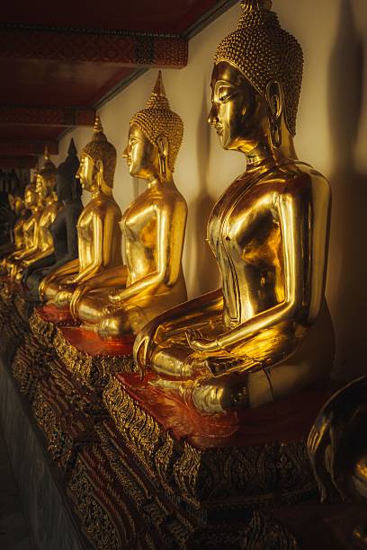 istock Golden Buddha statues at Wat Pho in Bangkok 2213468193