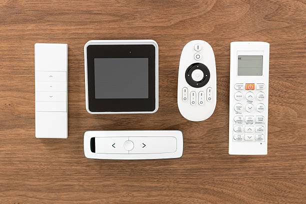 Flat lay of a Variety of remote controls to control different appliances in a house
