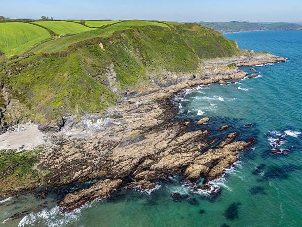 istock Rugged Cornwall coastline with green cliffs and turquoise sea. 2213468684