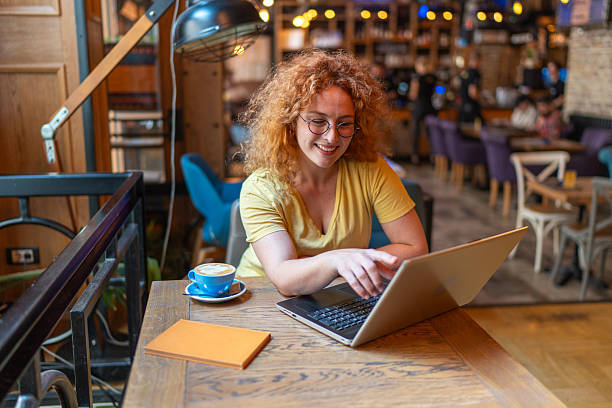 istock Freelancer working on laptop in cozy coffee shop 2213469363
