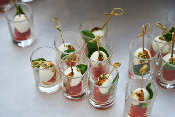 istock Cheese and tomato canape with sauce in a glass 2213472080