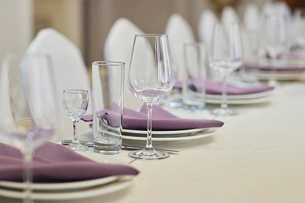 istock Table setting, ready for the reception of guests. Glasses for drinks on the table 2213472606