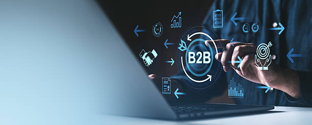 istock B2B technology concept with icons and businessman using laptop on dark background. 2213473058