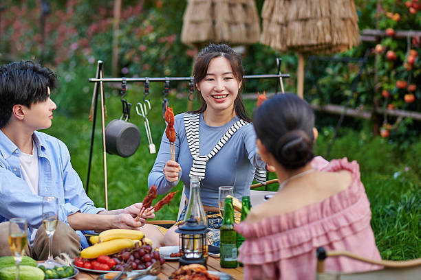 istock A Group of Asian Young People BBQ at Backyard Party 2213473546