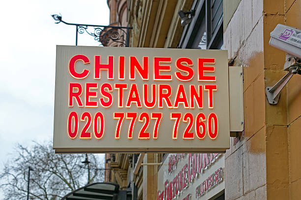 London, United Kingdom - January 23, 2013: Illuminated Sign Chinese Restaurant Telephone at Asian Cuisine Building Bayswater.