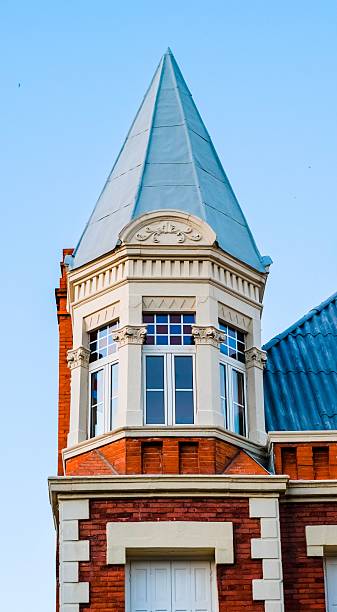 istock Historic Building Turret with Red Brick and Ornate Windows 2213480027