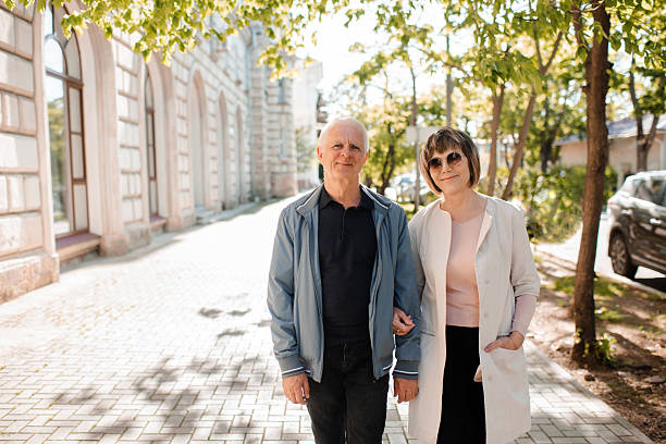 istock Smiling senior couple over city view 2213481704