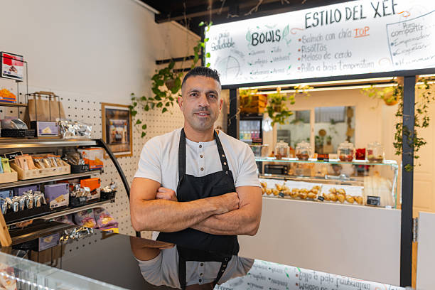 istock Confident bakery owner standing at the counter 2213484851