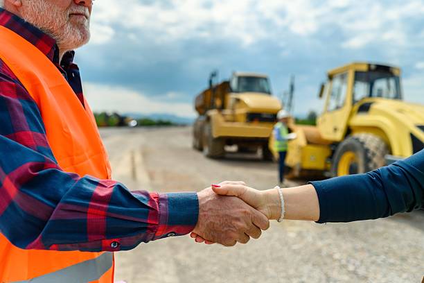 istock Engineer and investor on a road construction site 2213490289