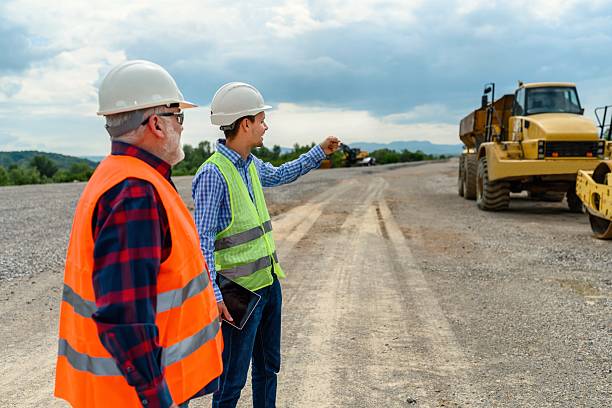 istock Engineer and investor on a road construction site 2213491784