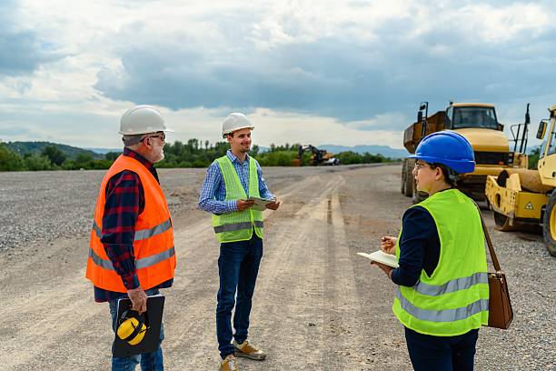 istock Engineers and investor on a road construction site 2213493905