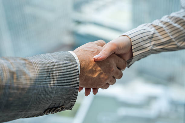 istock Closeup Handshake Symbolizing Business Agreement 2213496353