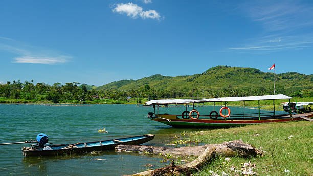 istock Village Lake Boat Pair 2213503884