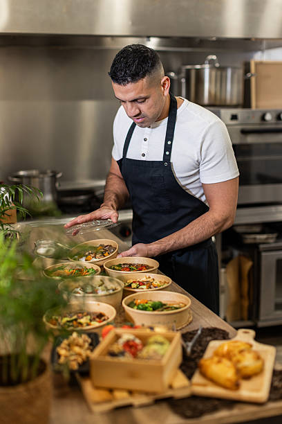 istock Chef Preparing Eco-Friendly Takeout Meals 2213509826