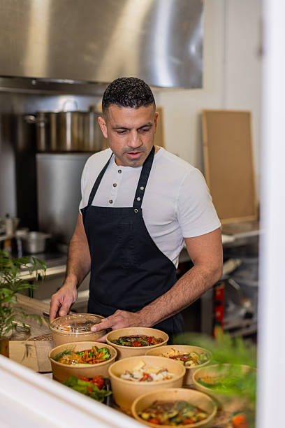 istock Chef Preparing Eco-Friendly Takeout Meals 2213509844