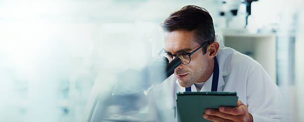 Space, tablet or man in lab with microscope, vaccine test or medical experiment for cancer treatment. Biotech, check or scientist with science results, study or sample with cure, banner or mockup