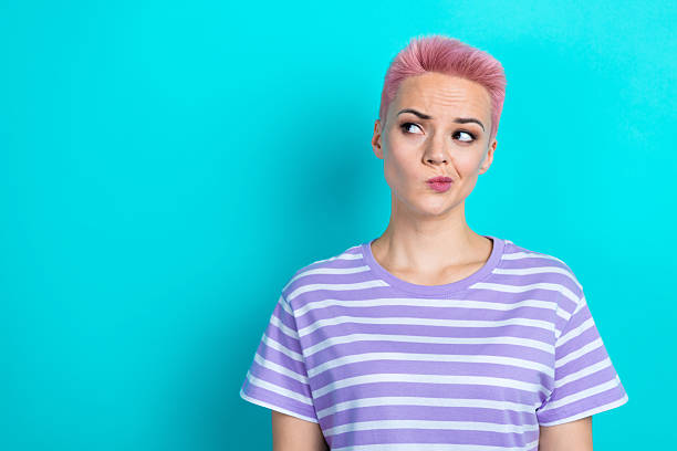 istock Portrait of pretty minded creative doubtful lady look interested empty space isolated on turquoise color background 2213513630