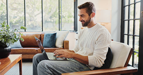 istock Smile, writer or man with laptop in remote work for newspaper article, report information or research. Freelancer,   happy or journalist typing with online info, news or review for journalism in home 2213514214