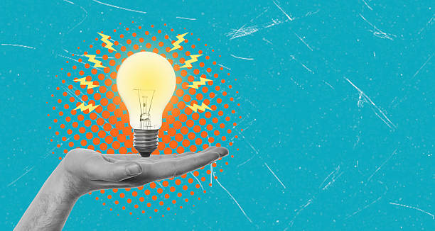 istock Modern art collage of a hand holding a light bulb. 2213514503