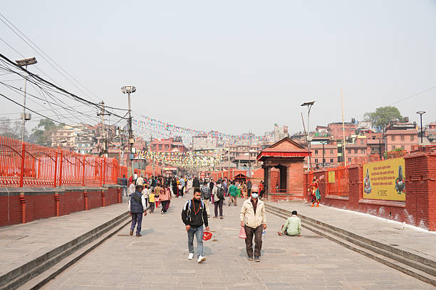 Kathmandu, Nepal - April 1, 2025: Local people are walking at Pashupatinath HIndu Temple.