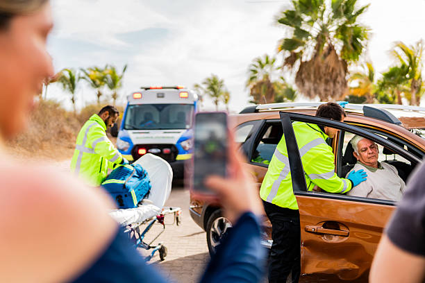 istock Paramedic helping senior victim on car accident 2213518270