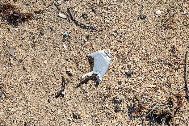 Boy hand holding a paper plane