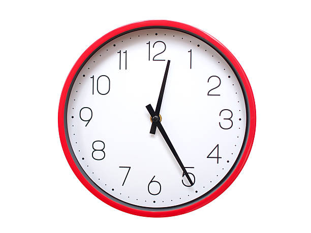 Minimalist Round Wall Clock Showing 00:25 or 12:25. Thin Black Numerals on White Wood Background.