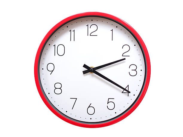 Minimalist red framed wall clock pointing at 02:20 or 14:20. Isolated on white background. Concept of time management.
