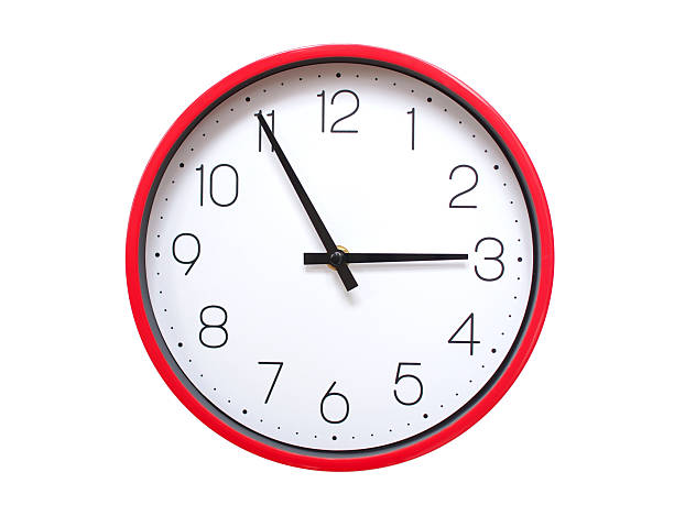 Minimalist red framed wall clock pointing at 02:55 or 14:55. Isolated on white background. Concept of time management.