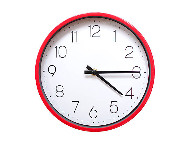 Minimalist red framed wall clock pointing at 04:15 or 16:15. Isolated on white background. Concept of time management.