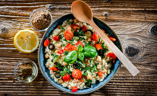 A plate of couscous served with vegetables and chickpeas