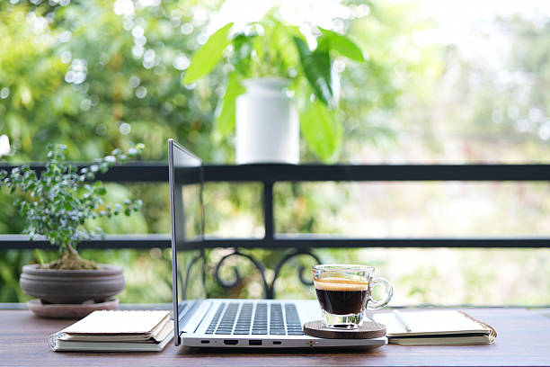 istock chilling balcony workspace with coffee drink and laptop 2213524839