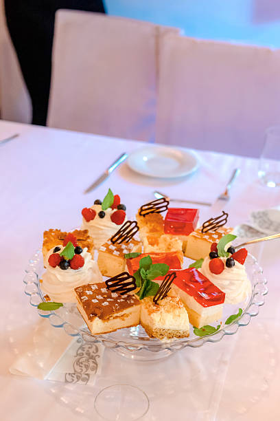 istock Sweet Pastries on Cake Stand at Celebration Table Gathering 2213529336
