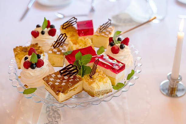 istock Sweet Pastries on Cake Stand at Celebration Table Gathering 2213529364