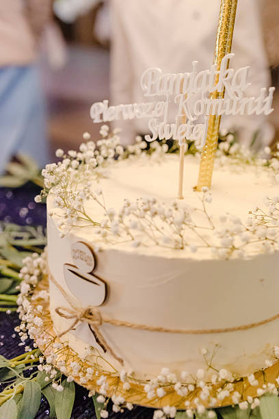 istock Large Communion Cake Served at First Holy Communion Celebration 2213530012