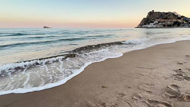 istock The Serene Beach at Sunset, where the Waves Whisper and Tranquility Embraces You 2213539270