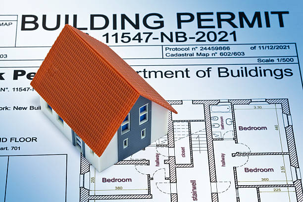 istock Building Permit concept with imaginary building approvation and residential home model 2213540214