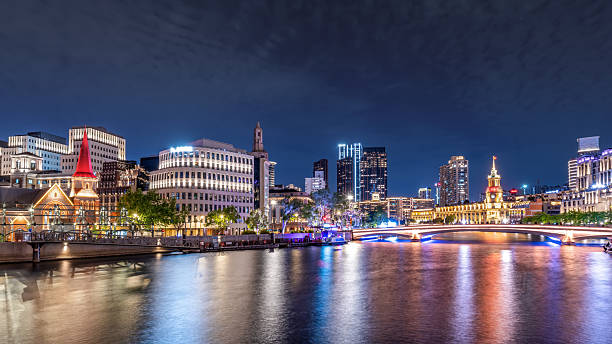 istock Captivating City Nightscape Reflecting on Tranquil River with Illuminated Skyscrapers 2213540608