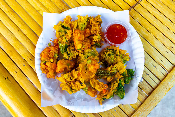 istock Various deep fried Thai snacks at the street stall Thailand. 2213542054