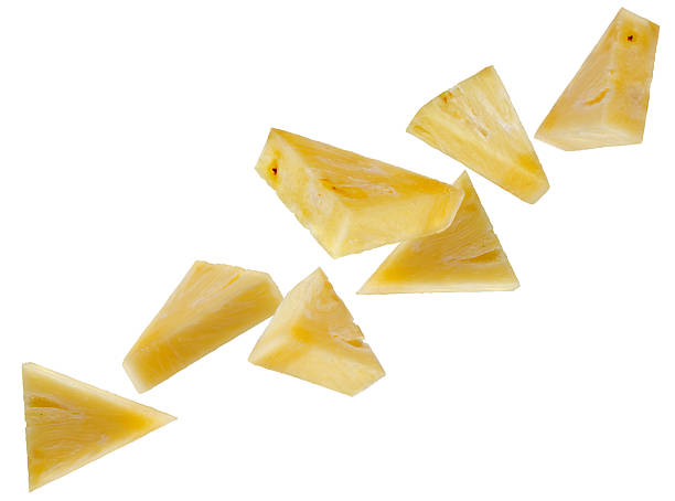 istock Absolutely peeled pineapple slices one eighth of a circle fly space forming a chain shape. Isolated on white. 2213546375