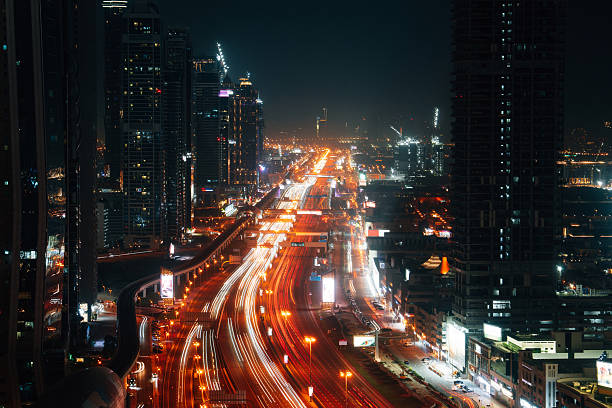 istock Light trails illuminating Dubai's Sheikh Zayed Road at night 2213552697