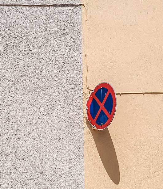 istock Minimalist urban wall with no parking sign. 2213554708