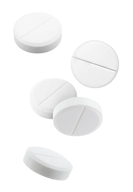 Tablets Blister with Coffee Bean and a Glass of Water.