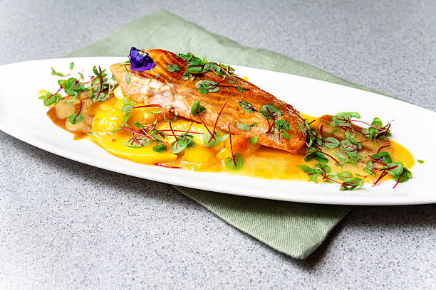 istock Gourmet salmon fillet with mango sauce and herbs. 2213558907