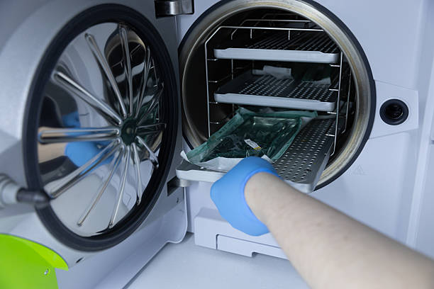 istock A Hand in a Blue Glove Loading Items into a Modern Autoclave for Sterilization, Highlighting Essential Practices in Healthcare and Laboratory Environments 2213559127